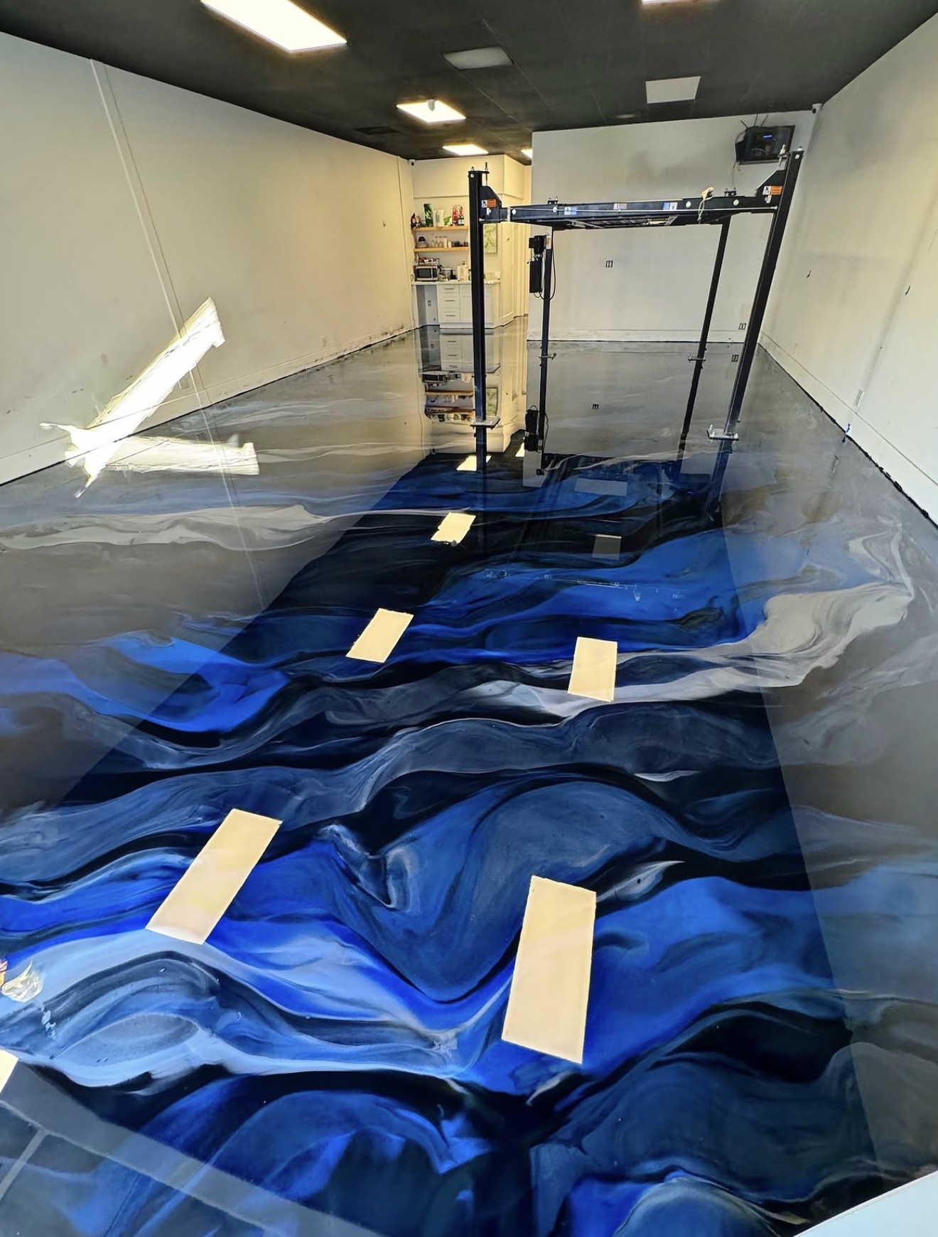 Deep blue metallic flake epoxy garage floor