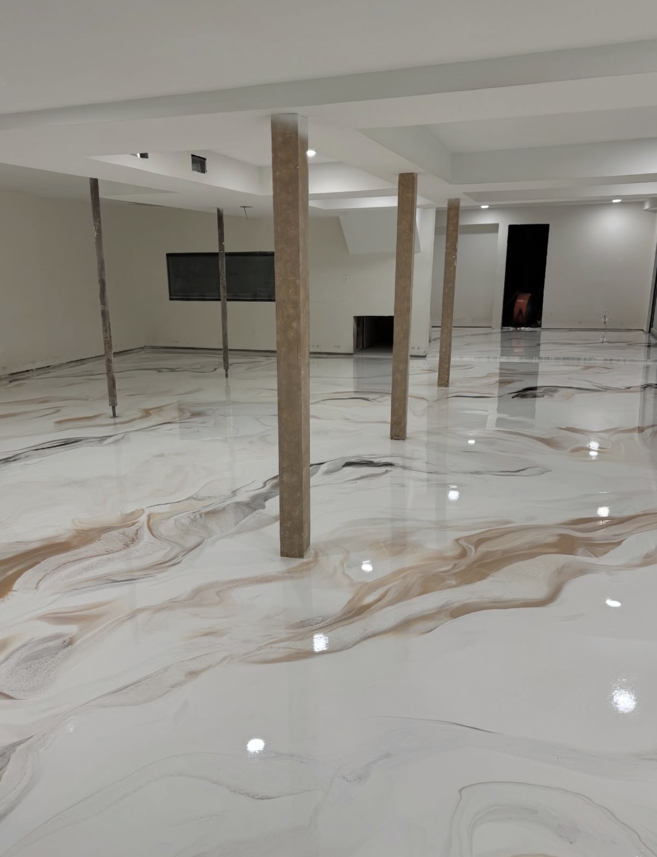 White and copper marbled metallic flake floor in an open space